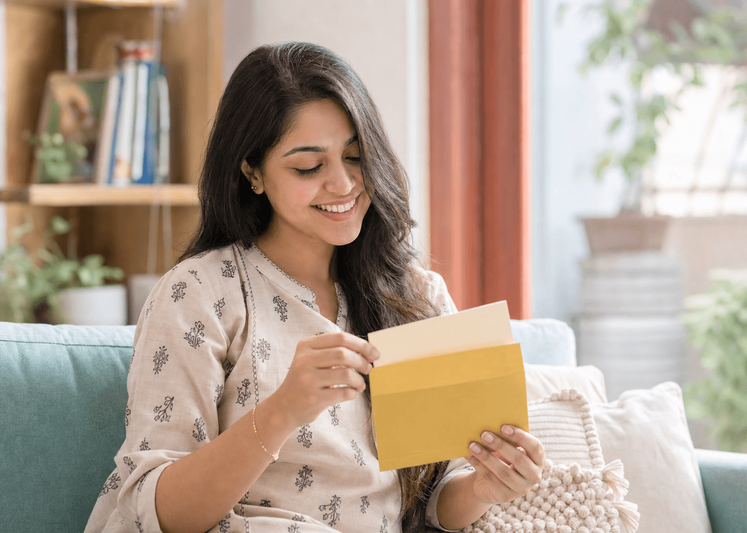 A woman smiling at a gift card reward